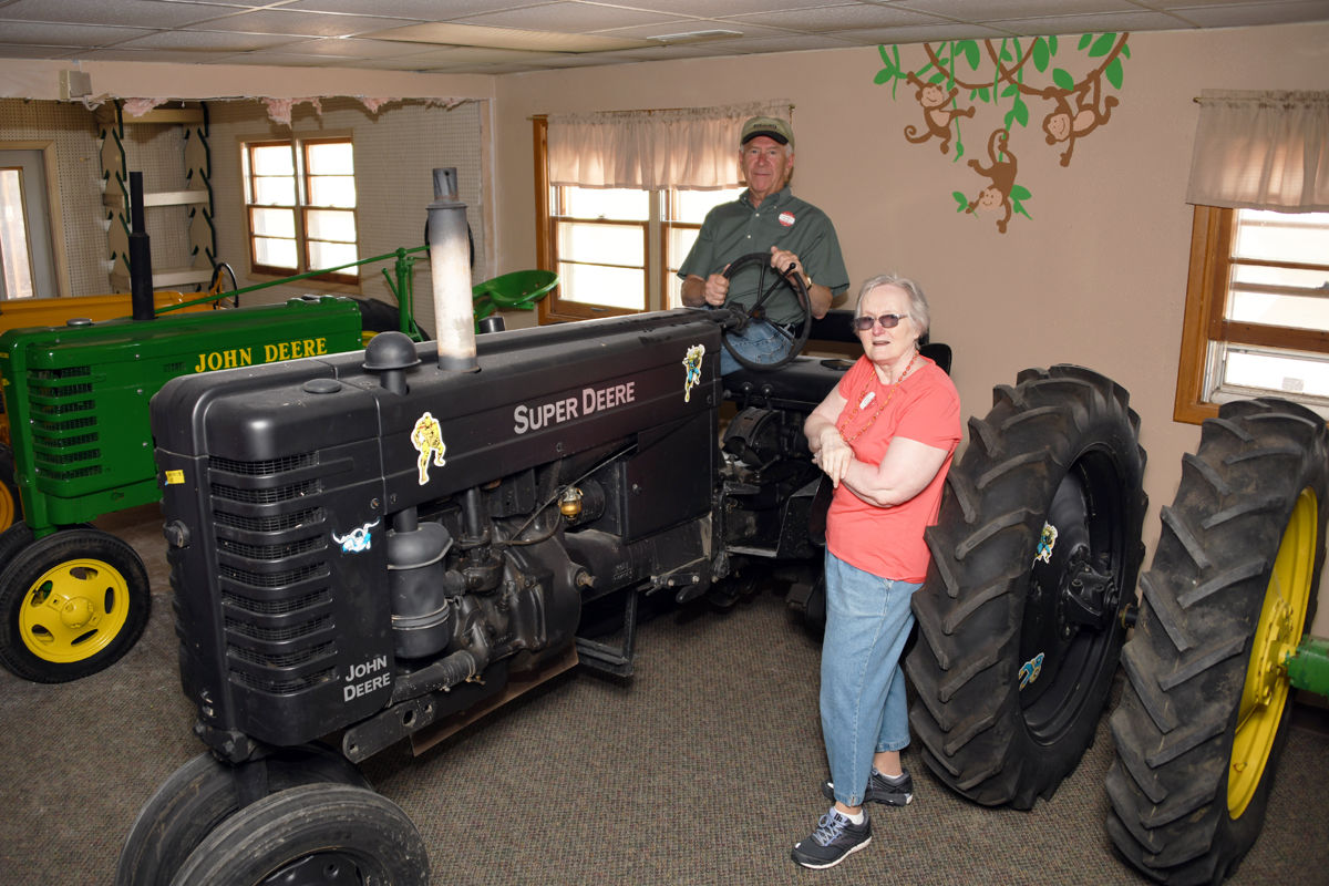 031 Franklin and Phyllis Hronik with black Super Deere decorated with super heroes.JPG